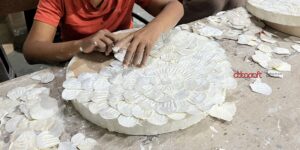 Women artisans at Abbacraft creating handmade furniture